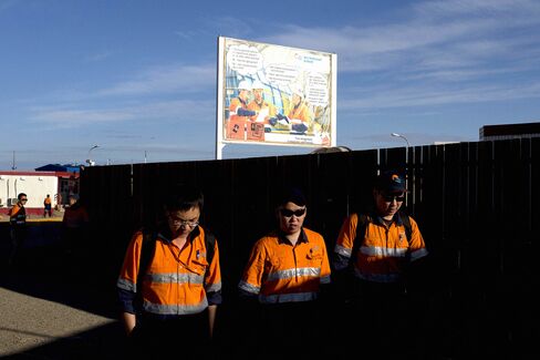 Employees walk to work from the living quarters at the Oyu Tolgoi copper-gold mine. China’s slowing demand has played no small part in Mongolia’s economic decline. In the first nine months of this year Mongolia exported $3 billion worth of products to China, down from $3.6 billion in the same period a year earlier.