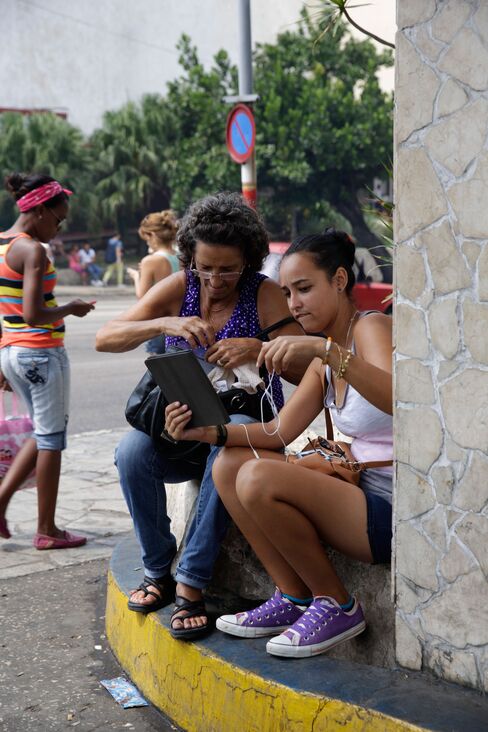 People gather within a government-provided Wi-Fi zone in Havana. For most Cubans, it’s the only way to get online.