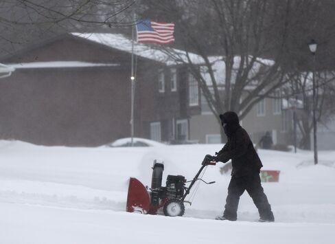 A resident plowing snow on Dec. 28, 2015 in Waterloo, Iowa.