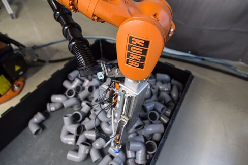 A Scape Technologies 3D camera sits on a Kuka KR 16 robotic arm at the robot collision testing facility in the Fraunhofer Institute in Magdeburg, Germany.