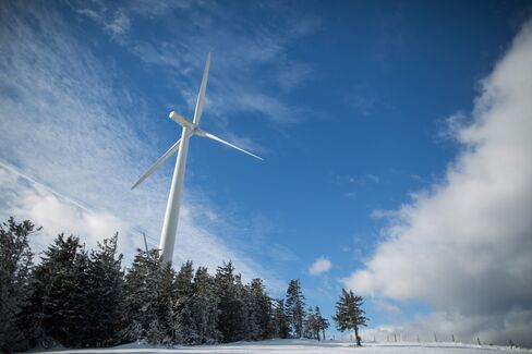A wind turbine stands amongst trees at the Steinriegel wind farm, operated by Wien Energie GmbH, in Steiermark, in the Styrian Alps, Austria, on Friday, Jan. 8, 2016. Chorus Clean Energy AG tapped proceeds of its recent share sale to buy two wind farms in Austria with a total capacity of more than 21 megawatts. Photographer: Lisi Niesner/Bloomberg