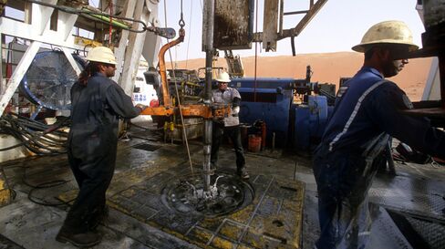 SHAYBAH, SAUDI ARABIA - MARCH, 2003:  Foreign workers on the Shaybah oil site in the middle of the Rub Al Khali ("the empty quarter") desert. March, 2003 in Shaybah, Saudi Arabia. (Photo by Reza/Getty Images)