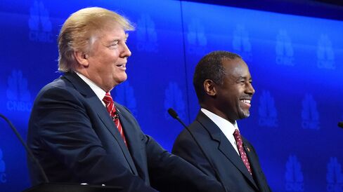 Republican presidential hopefuls Ben Carson and Donald Trump smile during the CNBC debate on Oct. 28, 2015, in Boulder, Colorado.