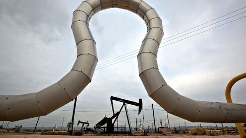 A pumpjack operates above a Chevron Corp. oil well near Taft, California.