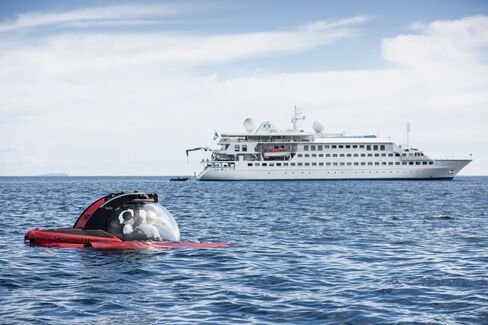 Crystal Esprit's two-passenger, submersible vessel in front of the cruise ship.