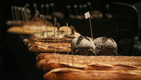 Baguette, European style bread on black wood table in morning time