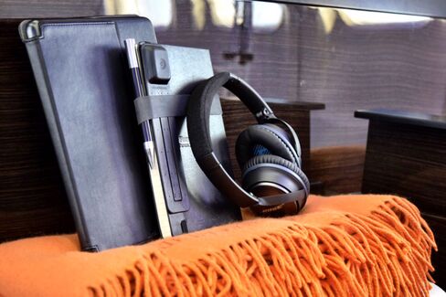 Guests receive their own personal Bose headphones, leather travel journal, iPad Air, and Mongolian cashmere blanket.