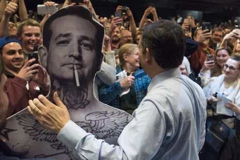 Ted Cruz poses with a cardboard cutout of himself at a rally in Columbus on March 13.