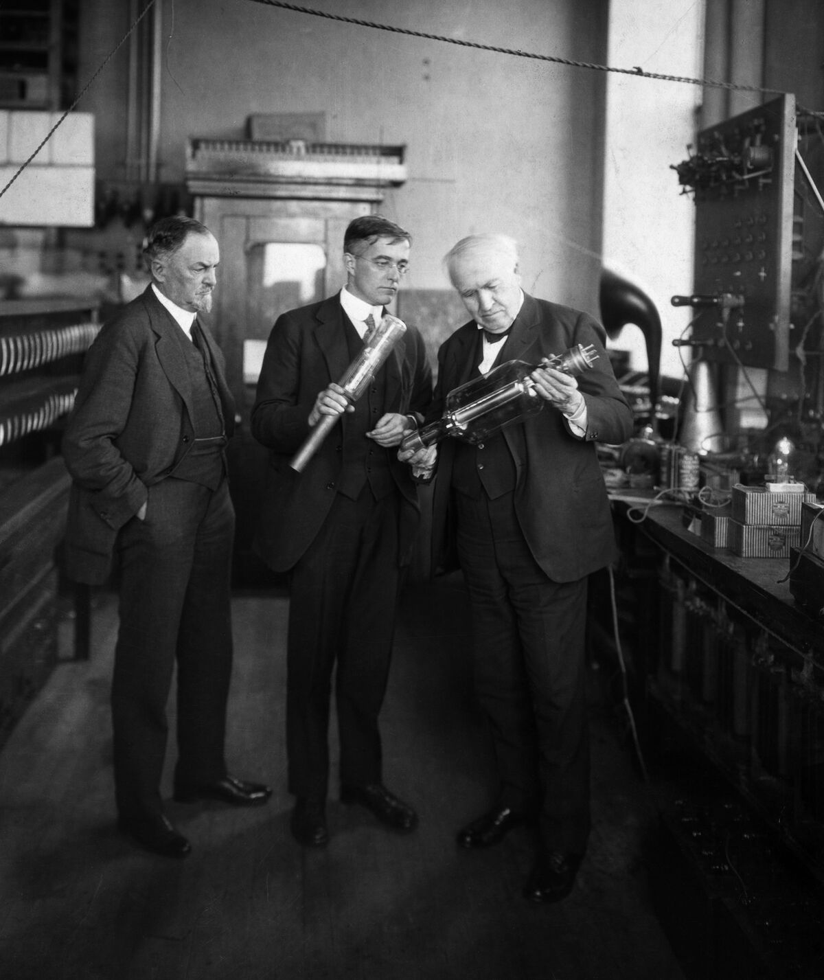 Thomas Edison, right, and Dr. Irving Langmuir, center, are shown discussing the vacuum tube at the General Electric Research Laboratory in Schenectady, N.Y., circa 1904-25.