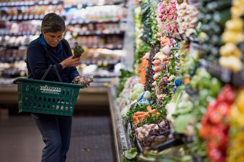 A customer shops for produce at a Whole Foods Market Inc. store in Oakland, Cali., on May 6, 2015.
