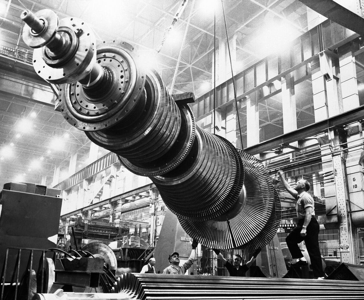 A turbine rotor, which is being hoisted by a giant crane at the General Electric turbine plant in Schenectady, N.Y., on Feb. 21, 1952. The heart of a turbine generator, the rotor weighs 42,200 pounds but has the precision of the finest watch.