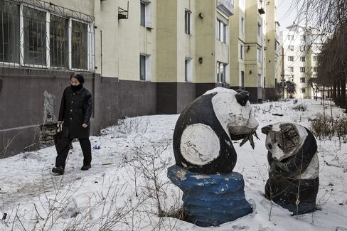 Statues of pandas and residential buildings. 