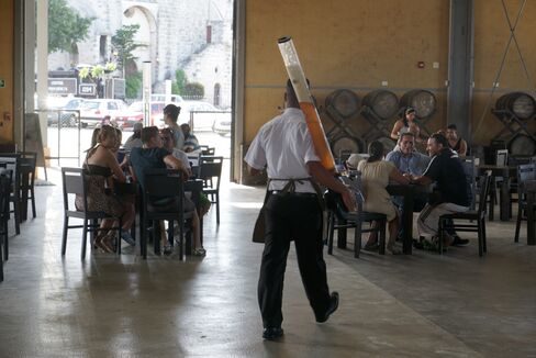 A waiter delivers beer at a microbrewery in Havana's old port. 