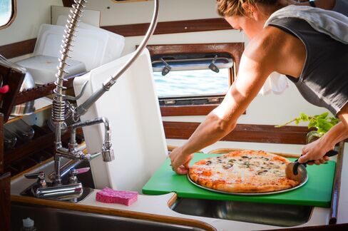 Many areas of the galley perform double duty to make the 12-by-16-foot space more efficient.