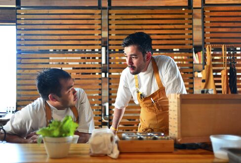 Paul Qui (left) and Jorge Luis Hernandez, chefs of Qui in Austin, Texas.