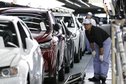 An employee inspects the paint finish of a Lexus NX SUV at the Miyata plant in Fukuoka Prefecture. Lexus has long prided itself for home-grown craftsmanship, with artisans on Japan assembly lines donning white gloves and honing years of factory experience before being entrusted to handle final inspections.

