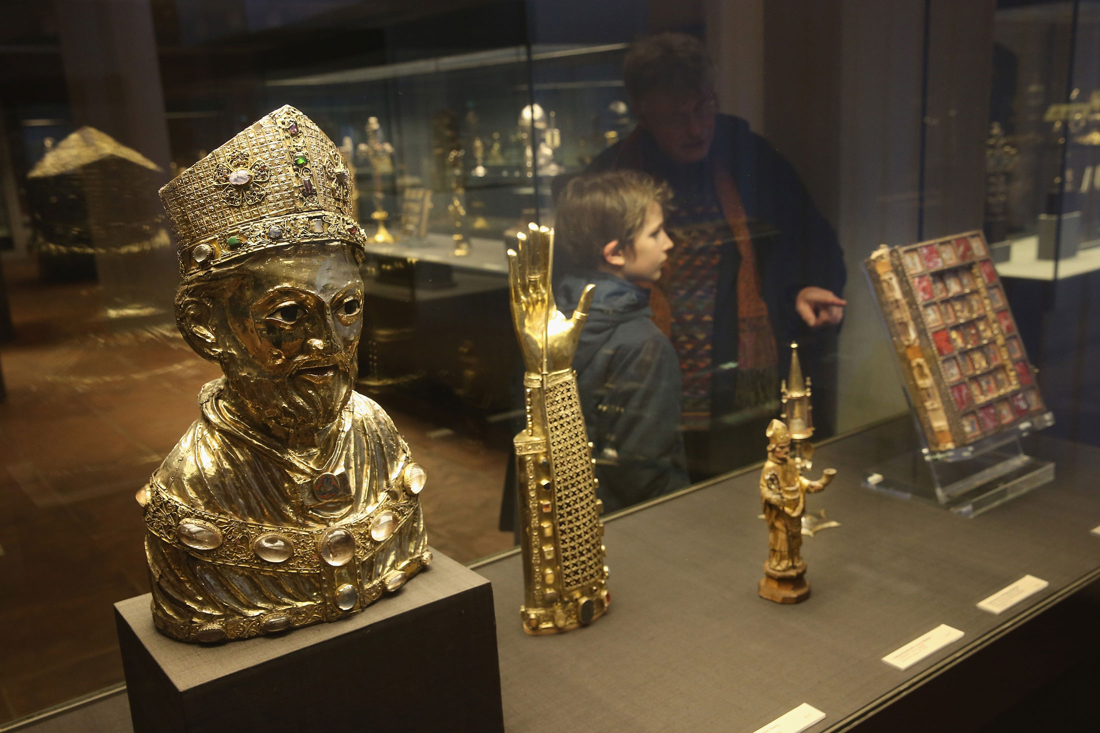 A father and son look at artifacts of the Guelph Treasure at the Museum of Decorative Arts on Feb. 26, 2015.