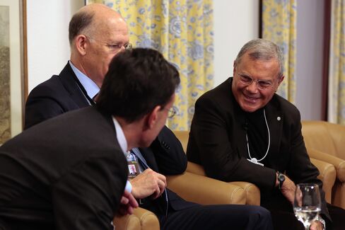 Eric Cantor, left, Donald Baer, center, and Martin Sorrell speak at Davos.