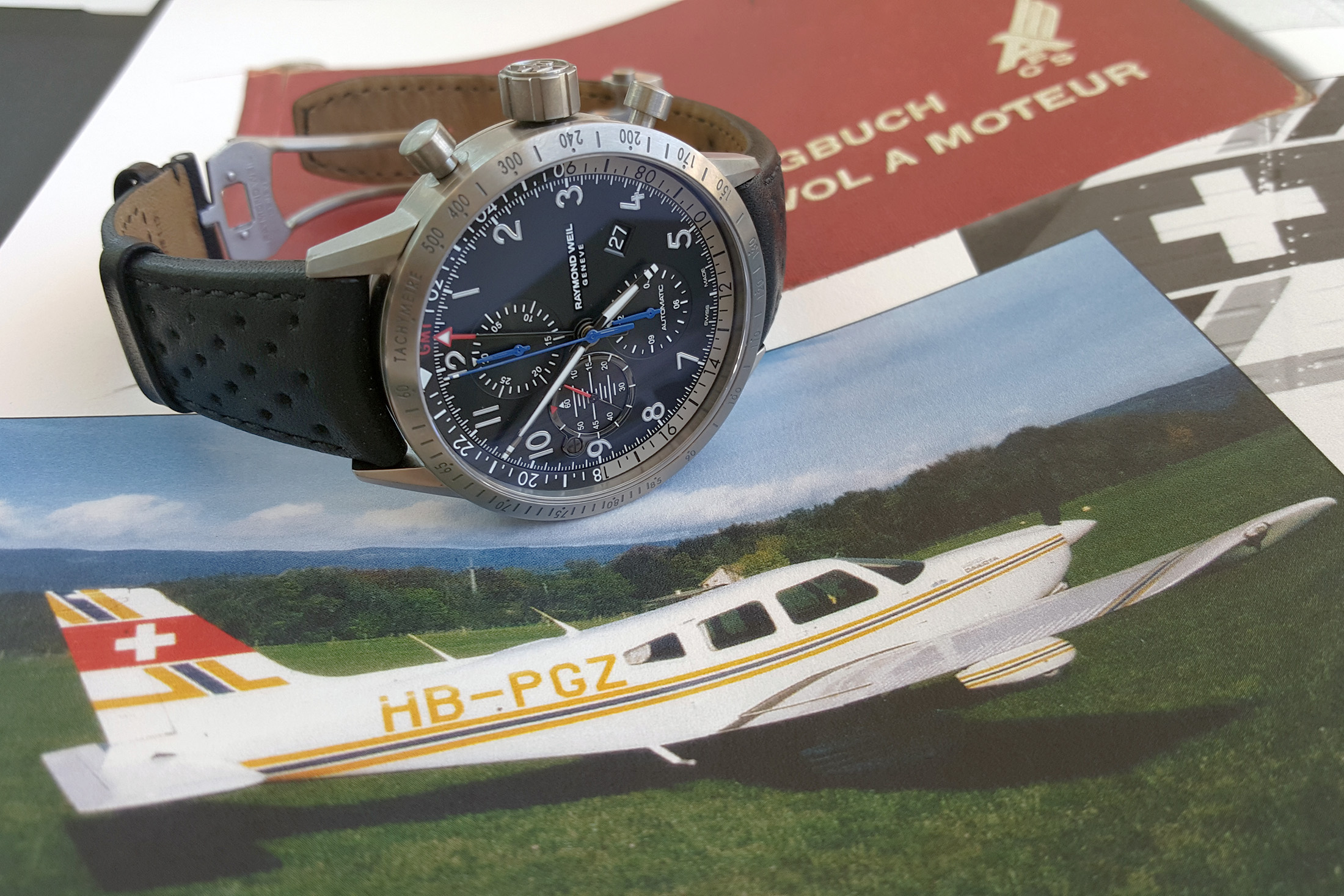 The new Freelancer Piper chronograph with a photograph of the plane that inspired its creation.