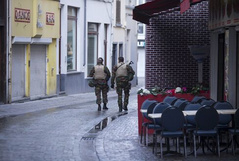 Soldiers pass bars in Brussels