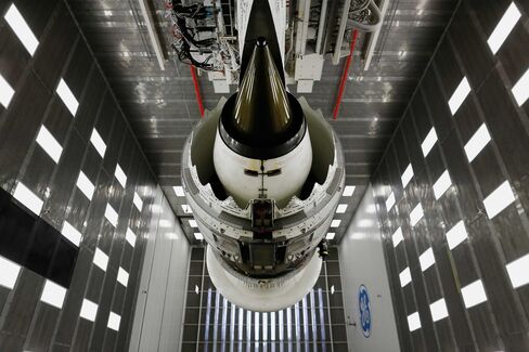 A GEnx-1B commercial jet engine hangs from the ceiling of a test tunnel at the GE Aviation Test Operations facility in Peebles, Ohio.
