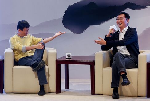 Jack Ma, Chairman of Alibaba Group, and 'Pony' Ma Huateng, Chairman and CEO of Tencent Holdings in 2013.
