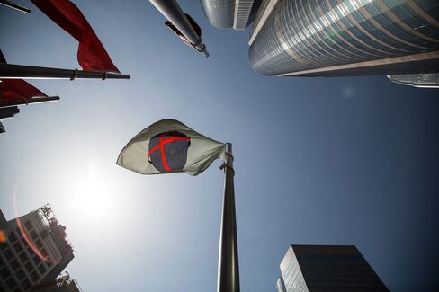 The Hong Kong Exchanges & Clearing Ltd. (HKEx) flag flies outside Exchange Square in Hong Kong, China.
