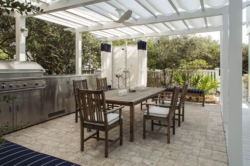 A terrace with an outdoor grill.