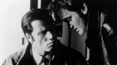 Actor John Travolta, left, and director Quentin Tarantino during production for 