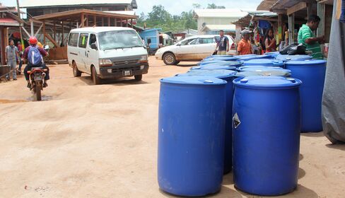 Fuel barrels sit near outdoor markets in Mabaruma.