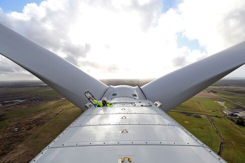 A job not for the acrophobic. An employee closes the nacelle hatch of a Vestas V136 wind turbine, 140 meters off the ground. The blade adds another 80 meters to the structure's height.