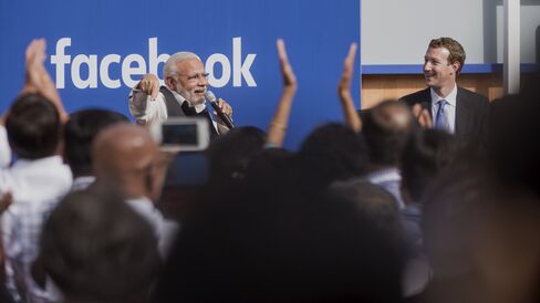 Narendra Modi, India's prime minister, speaks with Mark Zuckerberg at Facebook headquarters.
