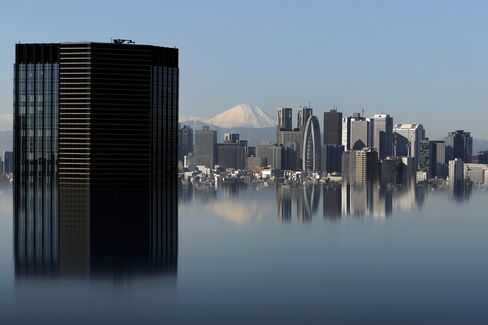 Mount Fuji and buildings in Tokyo. Photographer: Kiyoshi Ota/Bloomberg