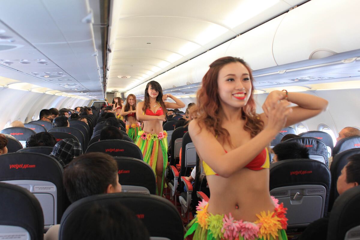 VietJet flight attendants perform a dance aboard the inaugural flight from Saigon to Nha Trang in 2012.