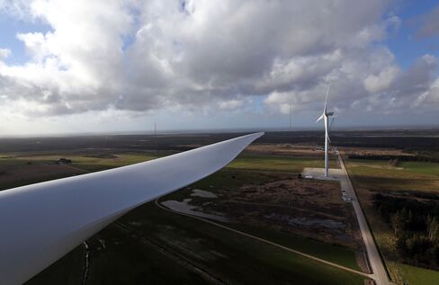 The giant blade of a Vestas V136, left, is as long as the wingspan of an Airbus A380 jumbo jet.