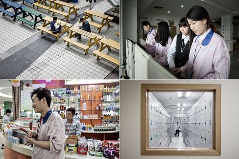 Clockwise from top left: Workers relax on benches during lunchtime; employees check their pay stubs at a computer terminal; a worker changes into his uniform; an employee in the canteen.