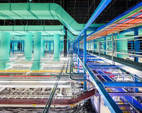 The new trading floor seen from a cat walk shows some of the miles of fiber-optic cables that connect servers in cages below.