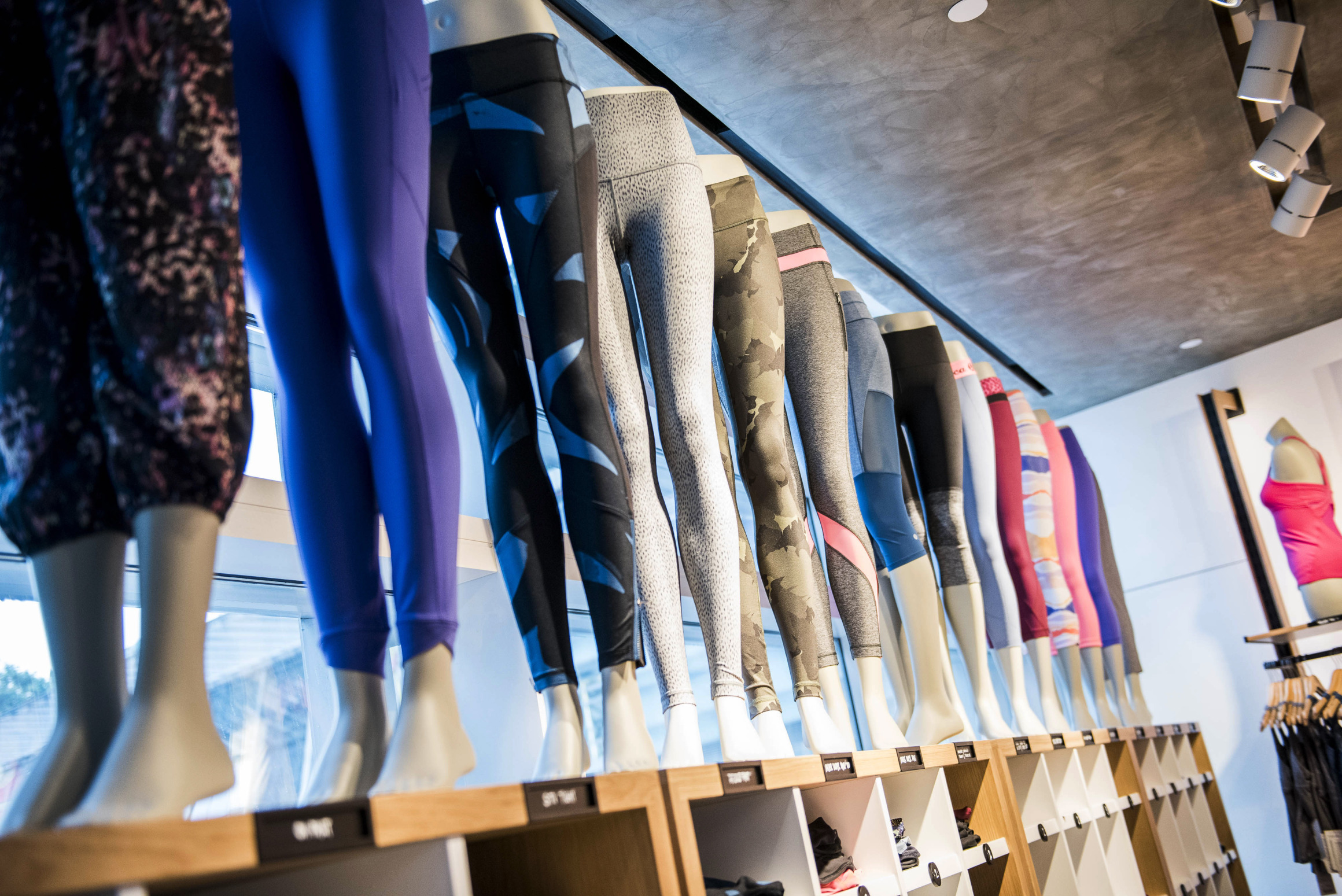 Athletic apparel sits on display inside a Lululemon Athletica Inc. store at International Finance Centre mall in Hong Kong, China, on Monday, June 22, 2015. Lululemon Athletica opened their first retail store in Hong Kong on June 19. Photographer: Xaume Olleros/Bloomberg