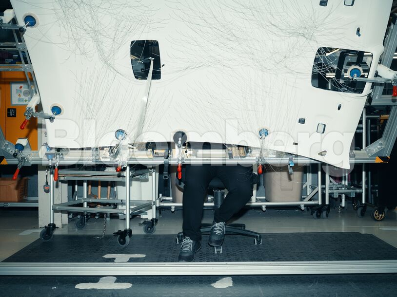 Technician fitting fibre-optic cables to a Starlight Headliner at Rolls-Royce