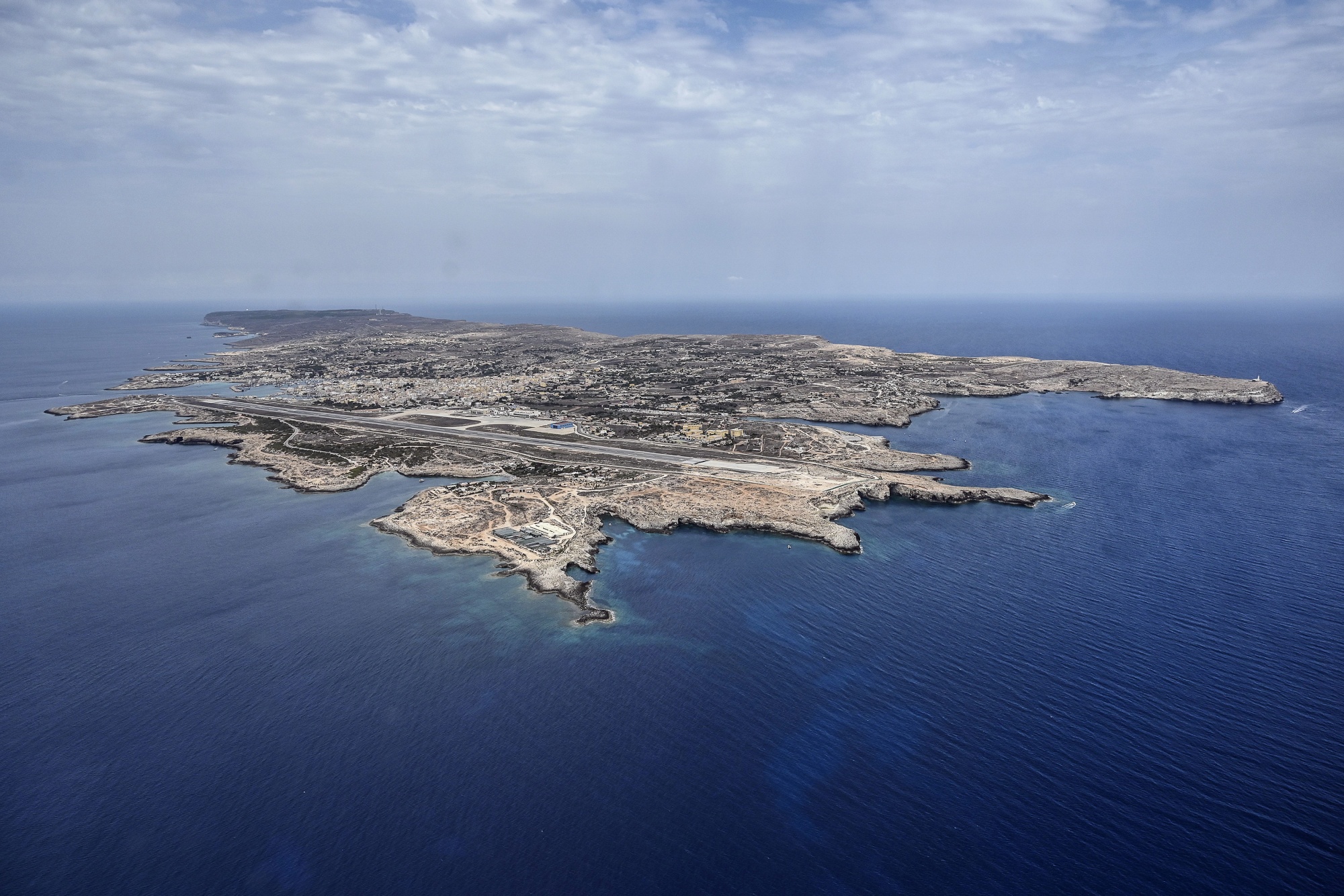 Lampedusa Migrant Island Welcomes the Unwanted Crossing the Mediterranean -  Bloomberg