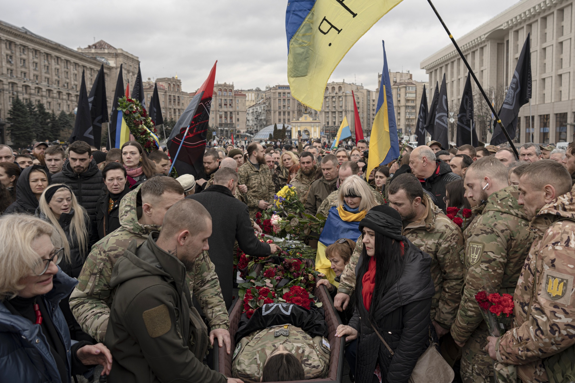 Mourners attend the funeral of fallen Ukrainian military commander Dmytro Kotsiubaylo at St. Michael’s Cathedral in Kyiv, Ukraine, in March. Tens of thousands of people have died in Russia’s attempt to seize control of its neighbor while the fighting has driven more than a third of Ukraine’s 41 million people from their homes.