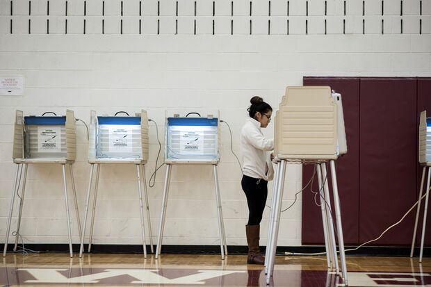 Person at voting booth