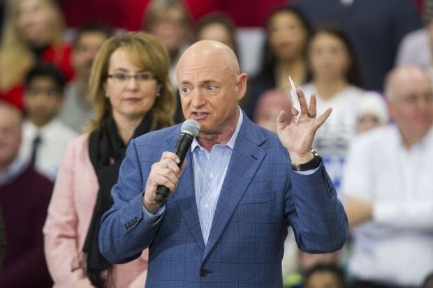 Mark Kelly with his wife, former Rep. Gabrielle Giffords, at a campaign event for Hillary Clinton in 2016