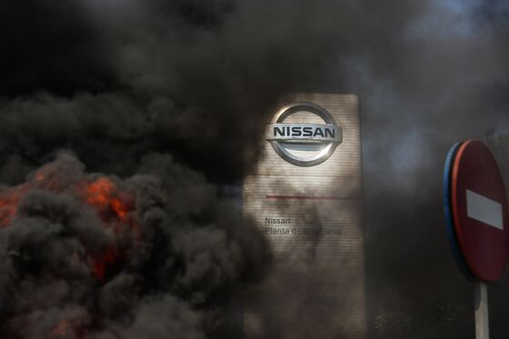 Nissan Workers in Barcelona Burn Tires in Plant Closures Protest