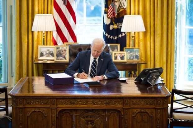 U.S. President Joe Biden signing the American Rescue Plan in the Oval Office of the White House in Washington, D.C., U.S.