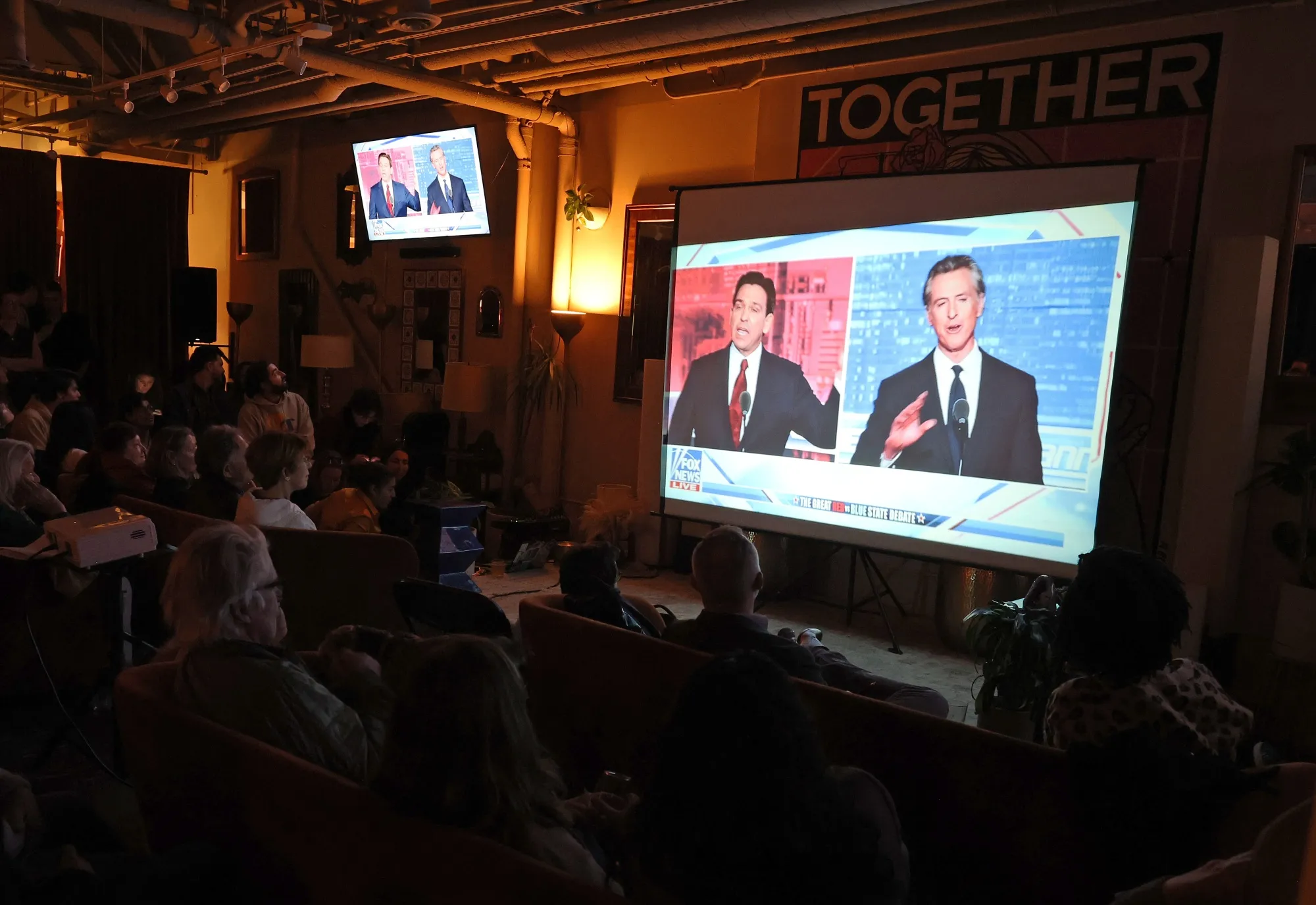 A watch party for the&nbsp;debate between Ron DeSantis and&nbsp;Gavin Newsom in San Francisco on Nov. 30.