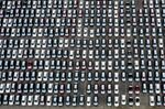 New vehicles are parked inside an auto terminal at the Port of Los Angeles on April 28.