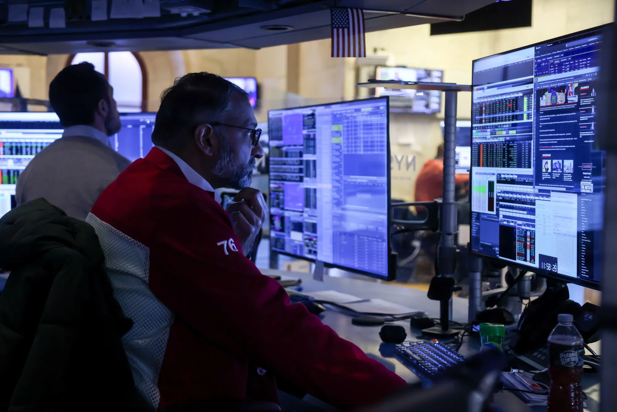Traders work on the floor of the New York Stock Exchange.