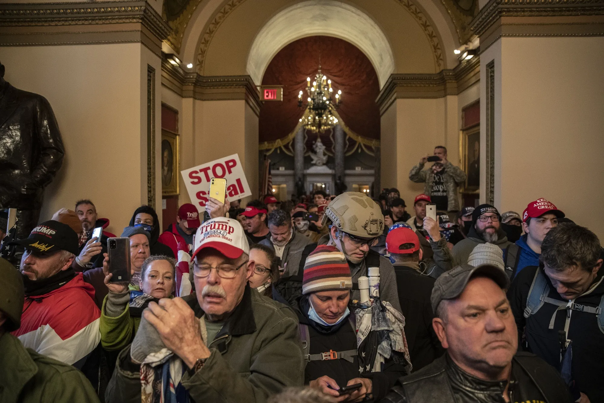 Demonstrators walk through the U.S. Capitol after breaching barricades during a protest on Jan. 6.