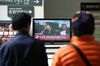 People watch a television screen broadcasting the ruling of former South Korean President Park Geun-hye's corruption charges at the Seoul Central District Court in Seoul, South Korea, on Friday, April 6, 2018